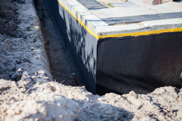 Professional Emergency Waterproofing technician working in New Holstein, WI